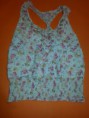 Blusa Xhilaration sin mangas y resorte en la cintura